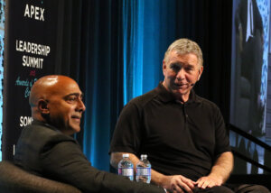 Photo of Rick Hansen on stage at Summit